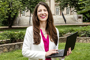 Francesca Tripodi, an associate professor in the School of Information and Library Science, poses for a portrait in front of Manning Hall on May 25, 2021, on the campus of the University of North Carolina at Chapel Hill.
