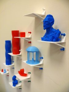 Variety of items created with 3D printer, including a small bust and a model of the UNC Old Well