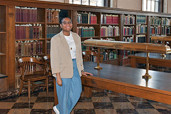 Lyric standing inside historic library