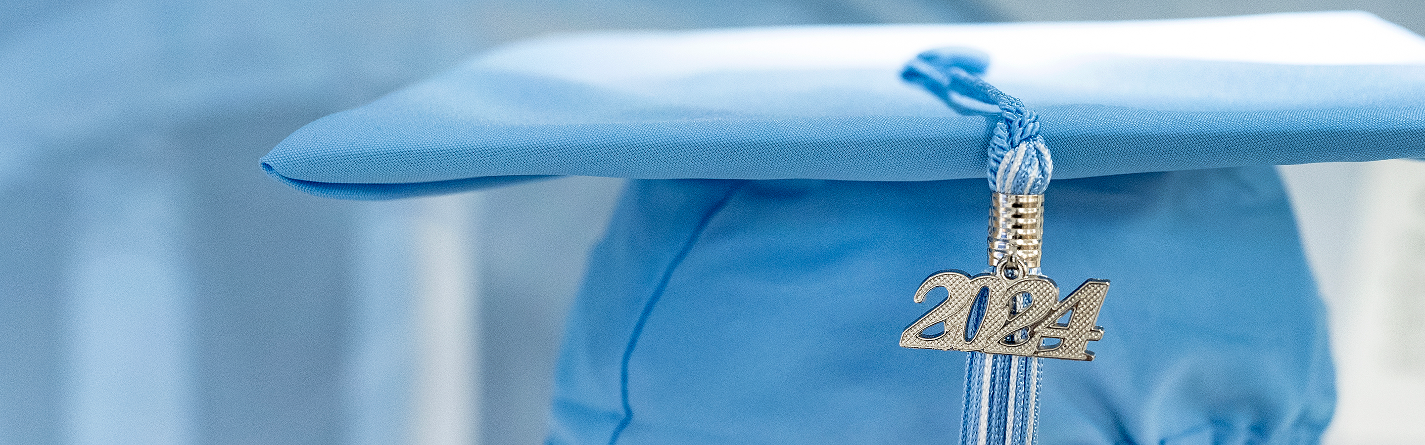 Blue graduation cap with 2024 tassel